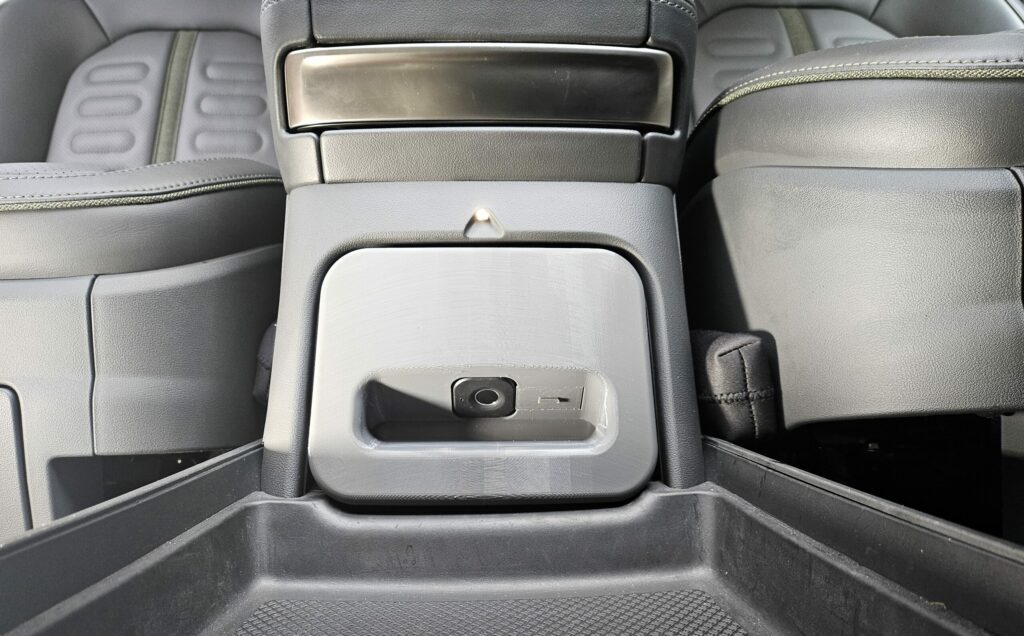 Photo shows RCS Safe installed in the Rivian center console cubby. The RCS Safe (stock version) is shown.