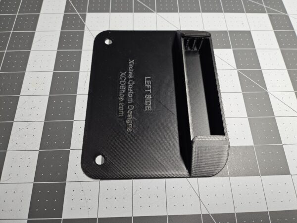 Closeup of a left-side unit license plate tool holder (LPTH), viewing the interior volume floor, and drain sump.