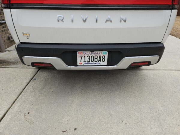 Front view of the license plate tool holder (LPTH) set installed on a Rivian R1T with no license plate frame.