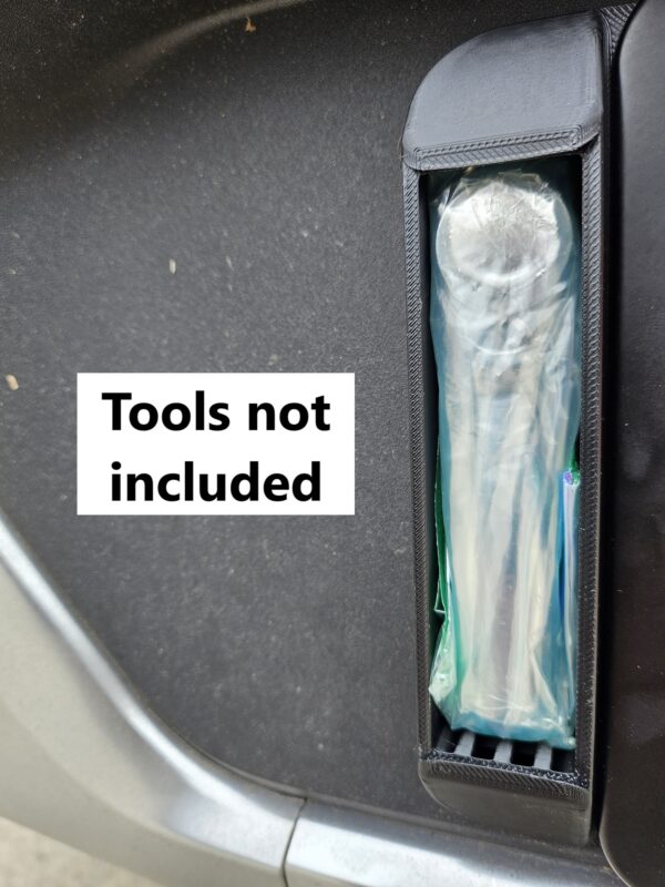 Left license plate tool holder (LPTH) installed on a Rivian R1T with an example tool (not included) stowed inside.