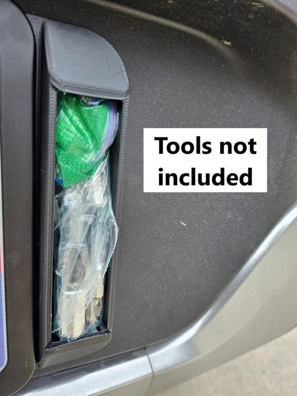 Right license plate tool holder (LPTH) installed on a Rivian R1T with an example tools (not included) stowed inside.